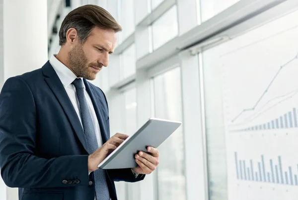 A business owner reviewing the best instant merchant account approval options on a tablet.