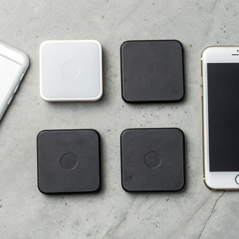 A variety of free mobile credit card readers displayed next to a smartphone.